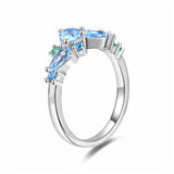 “Wisteria Whisper” Flower Bar Blue Topaz Silver Ring