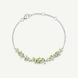 „Wisteria Whisper“ Flower Bar Peridot Silberarmband