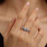 “Wisteria Whisper” Flower Bar Blue Topaz Silver Ring