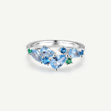 “Wisteria Whisper” Flower Bar Blue Topaz Silver Ring