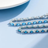 "Glamour Radiance" December Birthstone Fancy Cut Tennis Blue Topaz Sterling Silver Bracelet