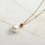 18k pearl necklace with blue sapphire stones in 18 rose gold