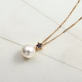 18k pearl necklace with blue sapphire stones in 18 rose gold