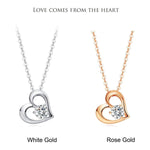 Open heart diamond necklace in white gold and rose gold