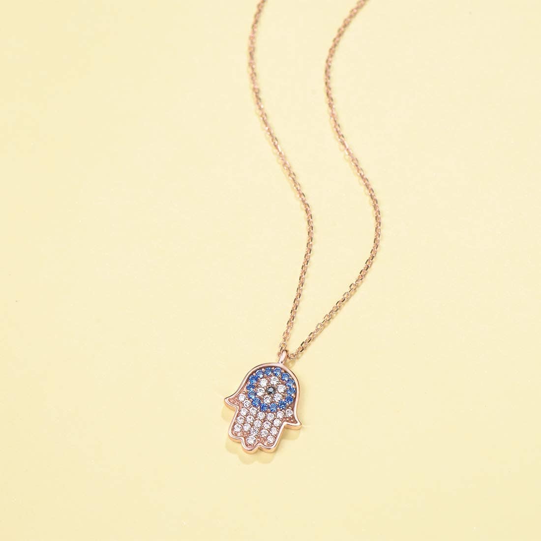 dainty hamsa pendant necklace in rose gold