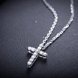white diamond round stone cross pendant